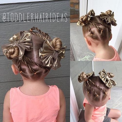 сладък little girls hairstyle with twists and buns