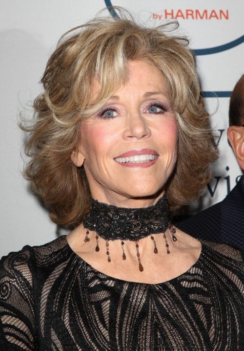 Jane Fonda medium hairstyle with bangs and highlights