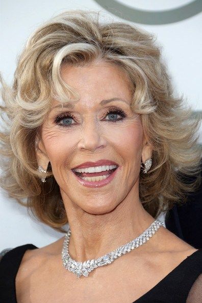 Jane Fonda layered hairstyle with curly bangs