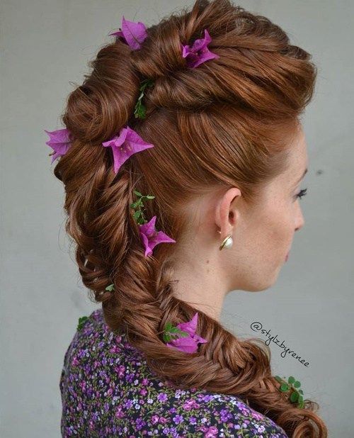 формален fishtail hairstyle with hair flowers