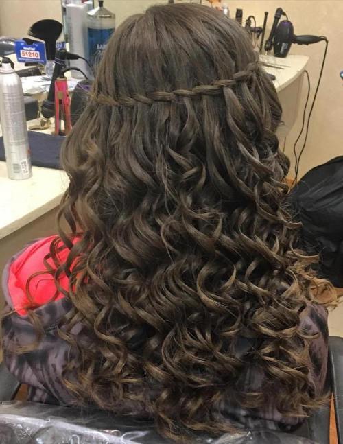 dlouho curly hairstyle with a thin waterfall braid