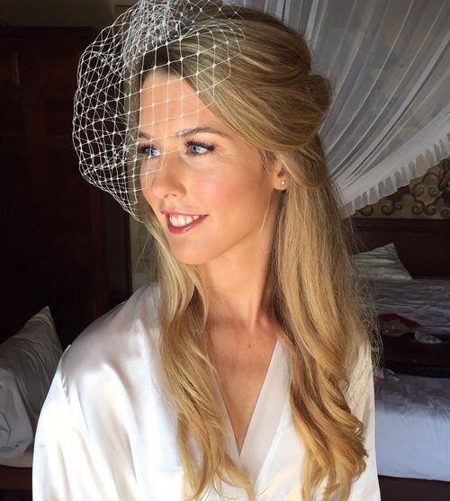 polovina up wedding hairstyle with birdcage veil