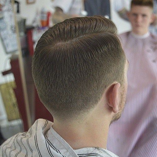 Männer's tapered side part haircut