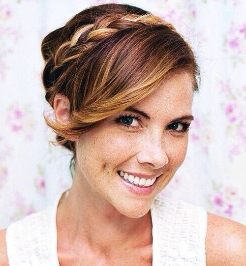 updo with side bangs and a crown braid