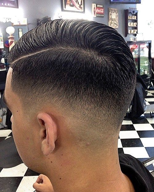 Männer's side part hairstyle with fade
