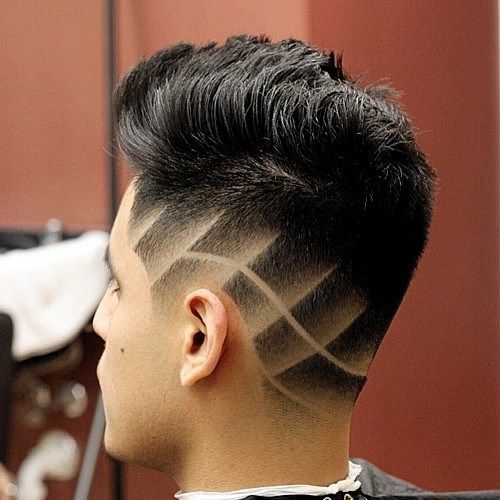 скосена haircut with shaved designs