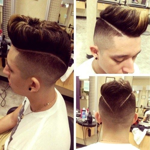 Mohawk with faded undercuts and shaven lines