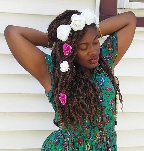 kinky twists hairstyle with hair flowers