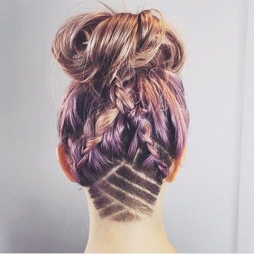 chaotický braids and bun hairstyle with shaved nape design