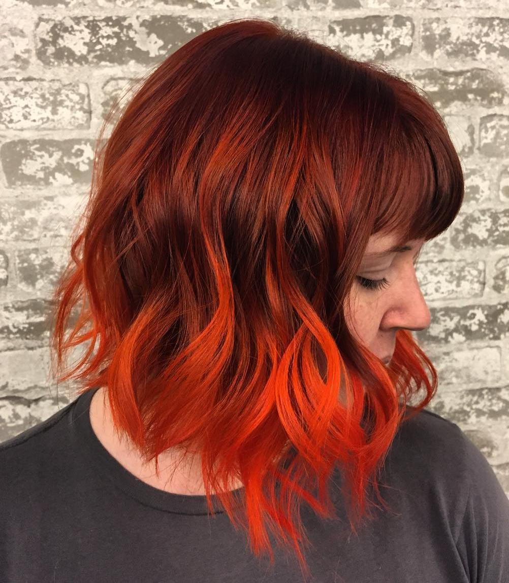 Kastanienbraunes Haar mit orange Balayage