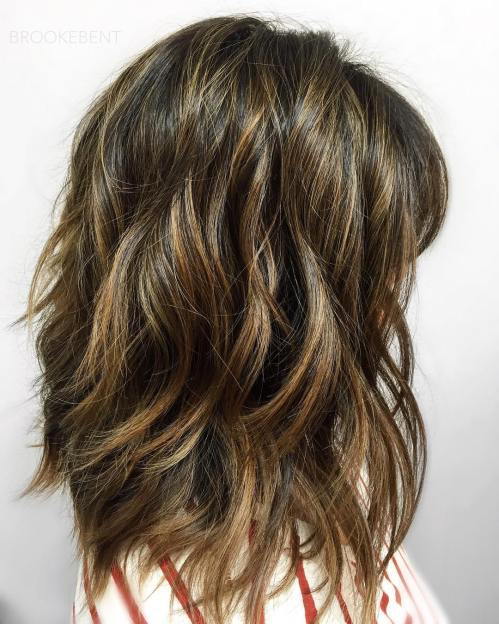 Layered Brunette Hairstyle With Golden Highlights