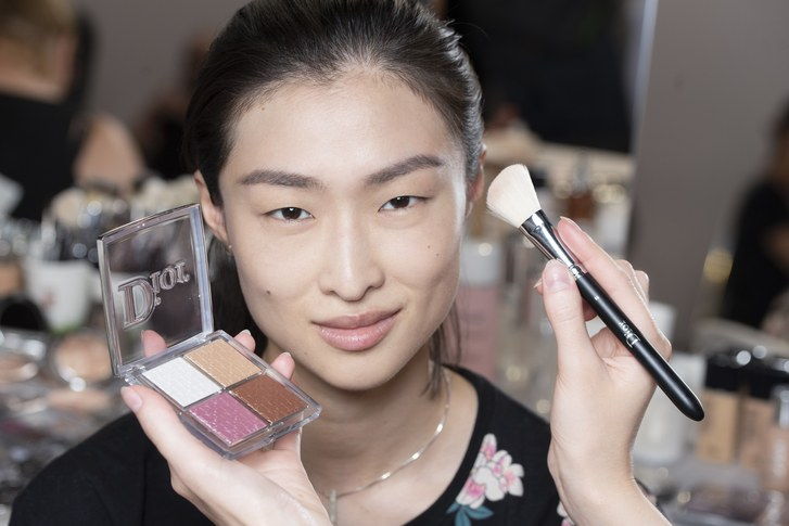 The new Dior Backstage highlighter palette being used on a model backstage at the Dior Cruise show in Chantilly, France. 