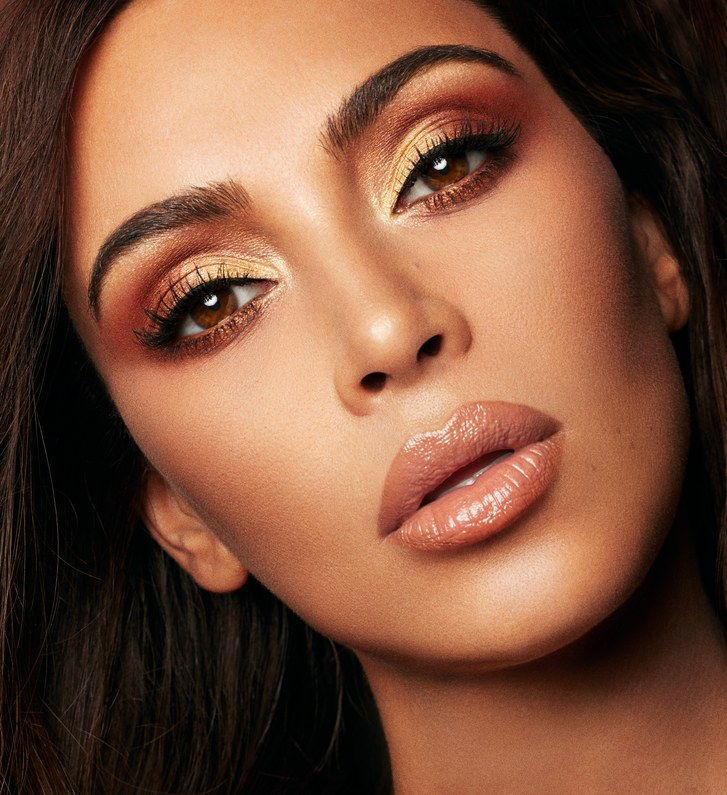Ким Kardashian West modeling the warm, metallic eye shadows from the KKW x Mario Collaboration collection 