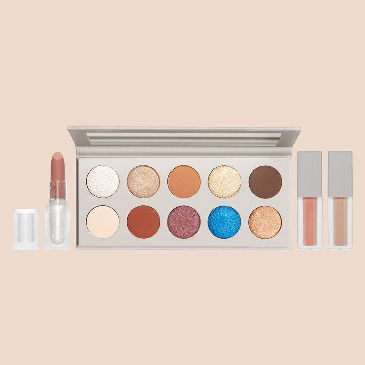 всичко three products that are part of the KKW Beauty x Mario Collaboration — lipstick, eye shadow palette, and two glosses. 