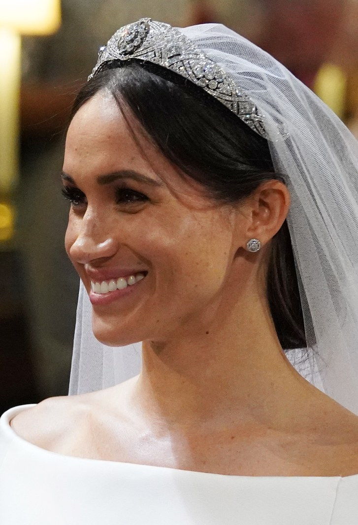 ميغان ماركل يبتسم أثناء زفافها إلى الأمير هاري في سانت جورج's Chapel at Windsor Castle on May 19, 2023 in Windsor, England. 