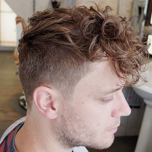kudrnatý long top short sides hairstyle for men