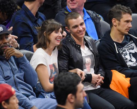 Alison Brie and Dave Franco attend a basketball game.