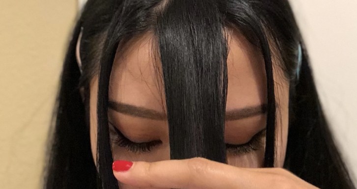 Instagram beauty star, Ellie Choi, prepares to cut her bangs. 