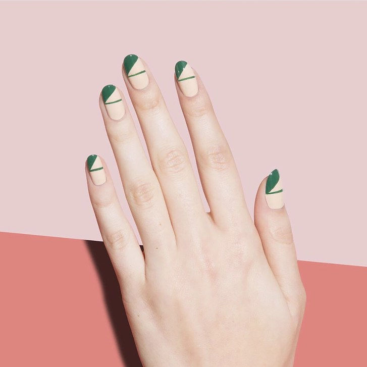 Mech green geometric nail art on a peach base by Paintbox nail salon.
